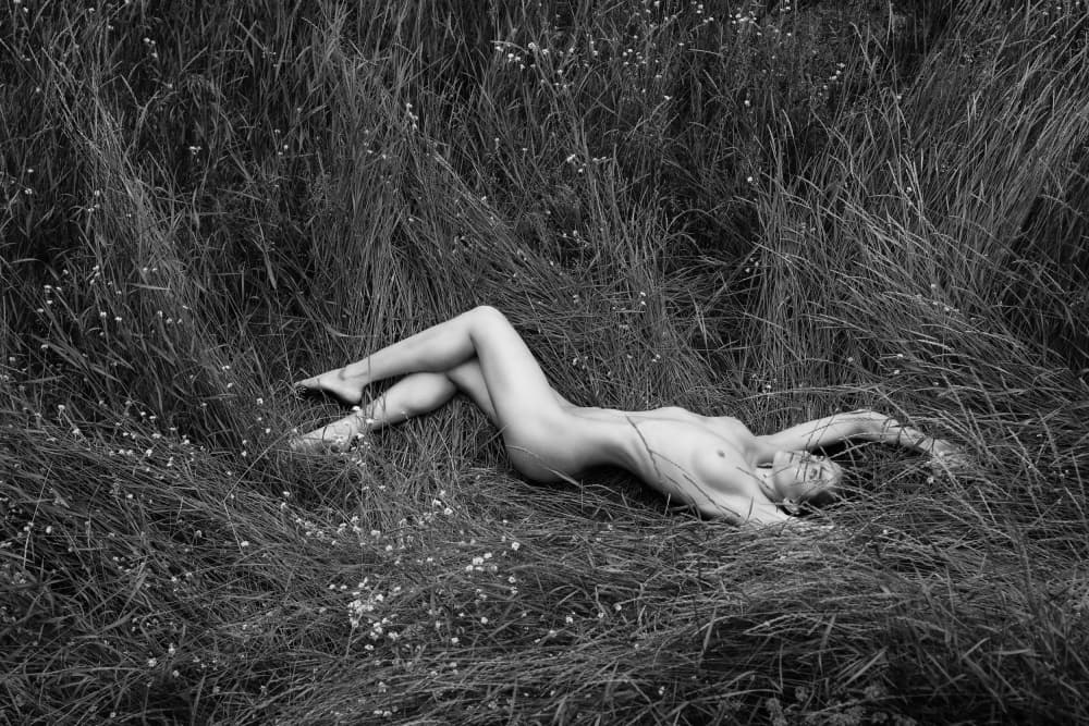 Serene Nude In Grass by Anton Belovodchenko — canvas wall art