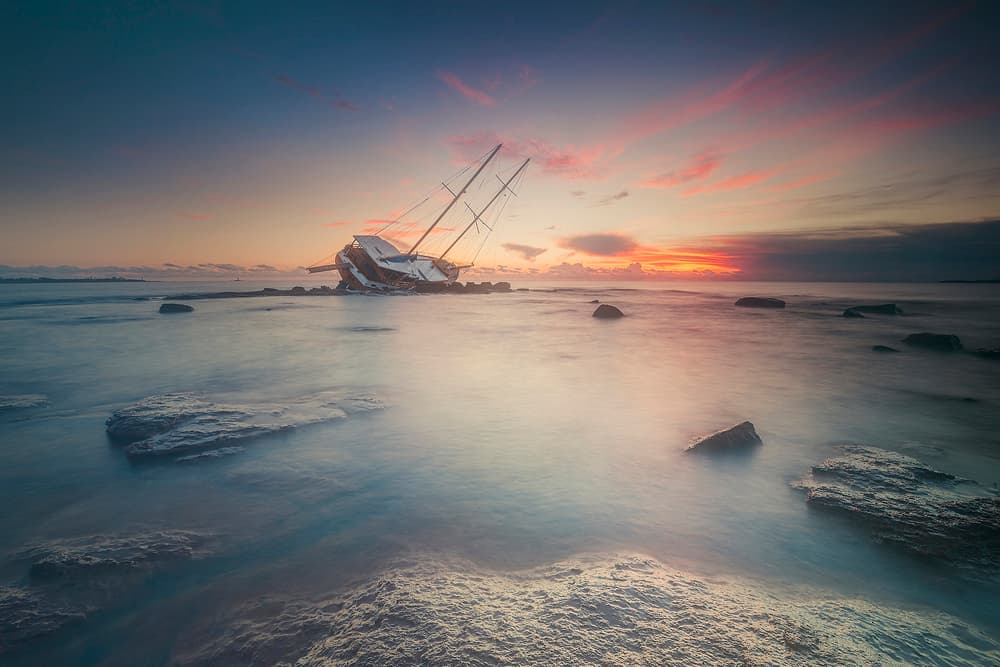 Misty Shipwreck Sunset by Daniele Atzori — canvas wall art