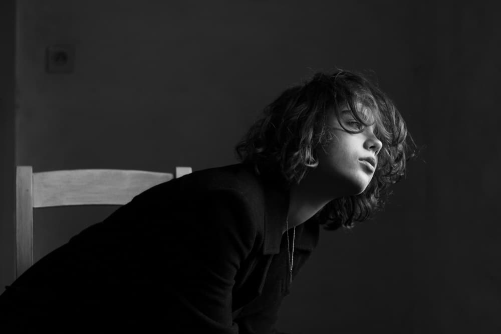 Pensive Youth Portrait by Małgorzata Masarz — canvas wall art