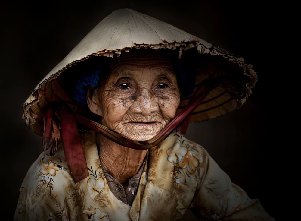 Smiling Elder With Hat by Irene Perovich — canvas wall art