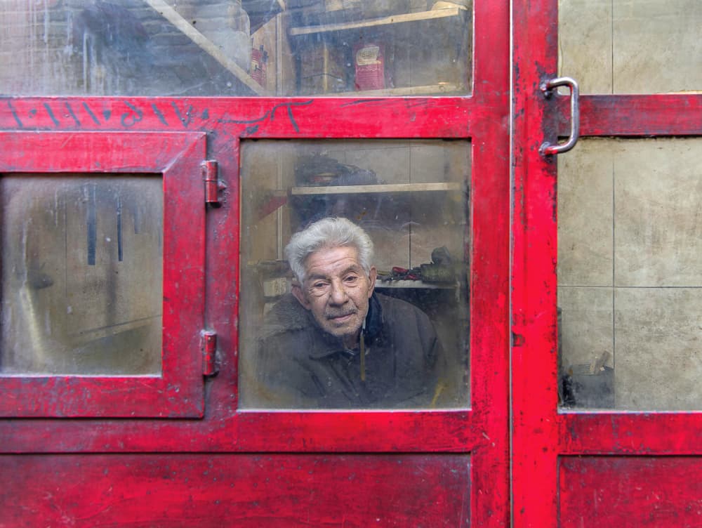 Old Man in Red Frame by Abbas Arabzadeh — canvas wall art