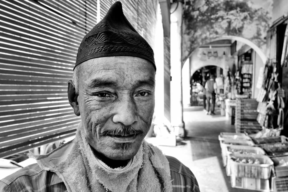 Smiling Market Vendor by Kieron Long — canvas wall art