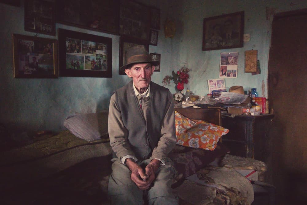 Pensive Man in Rustic Room by Zoran Toldi (EFIAP AZSF) — canvas wall art