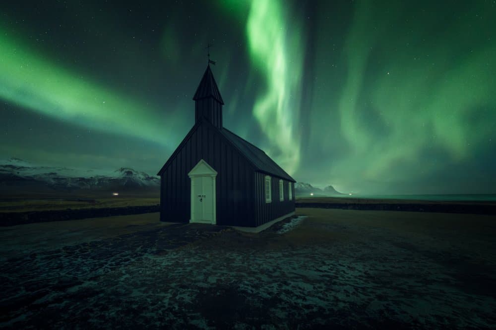 Northern Lights Black Church by David Martin Castan — canvas wall art