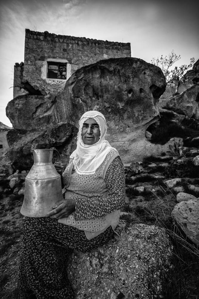 Traditional Woman with Jug by Sefa Yamak — canvas wall art