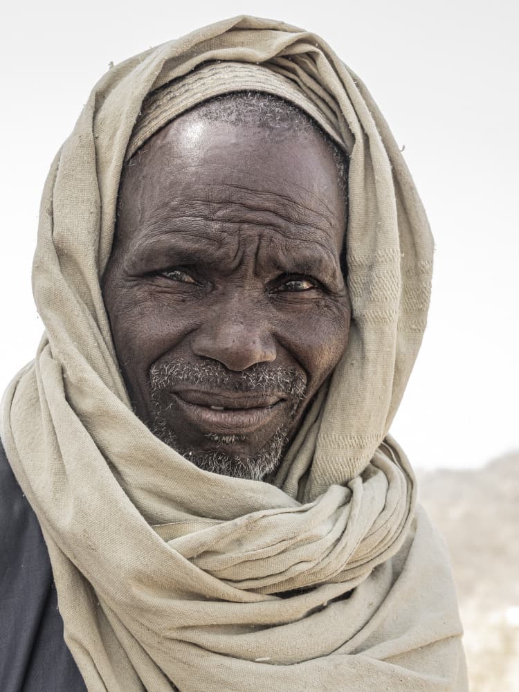 Elder Man's Gentle Smile by Elena Molina — canvas wall art