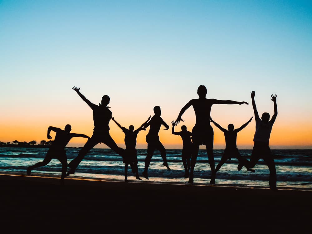 Joyful Sunset Jumps by Mohamed Kazzaz — canvas wall art