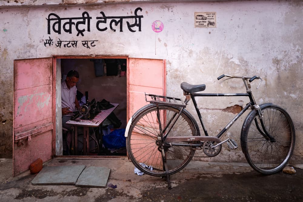 Tailor and Bicycle by Martin Froyda — canvas wall art