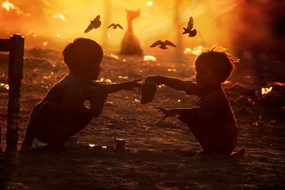 Children Sharing Golden Light by Svetlin Yosifov — canvas wall art