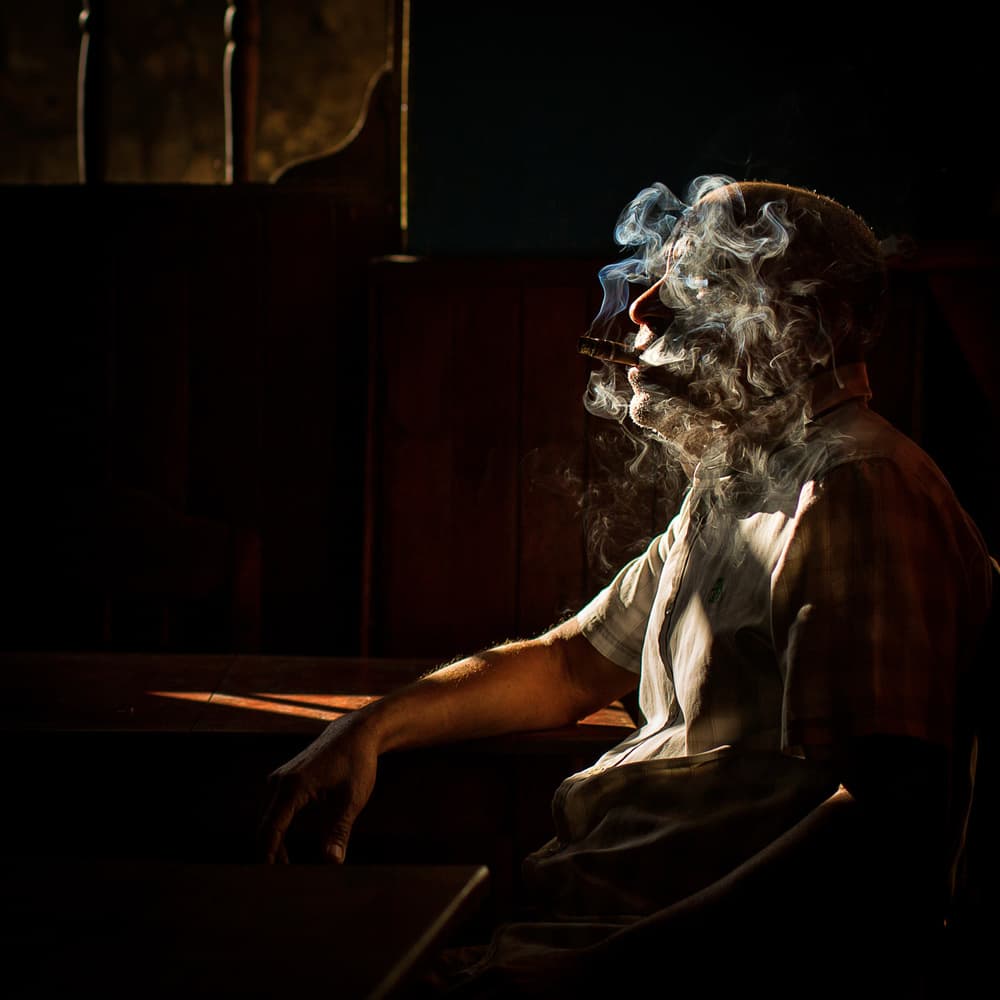 Contemplative Smoking Man by Dan Mirica — canvas wall art
