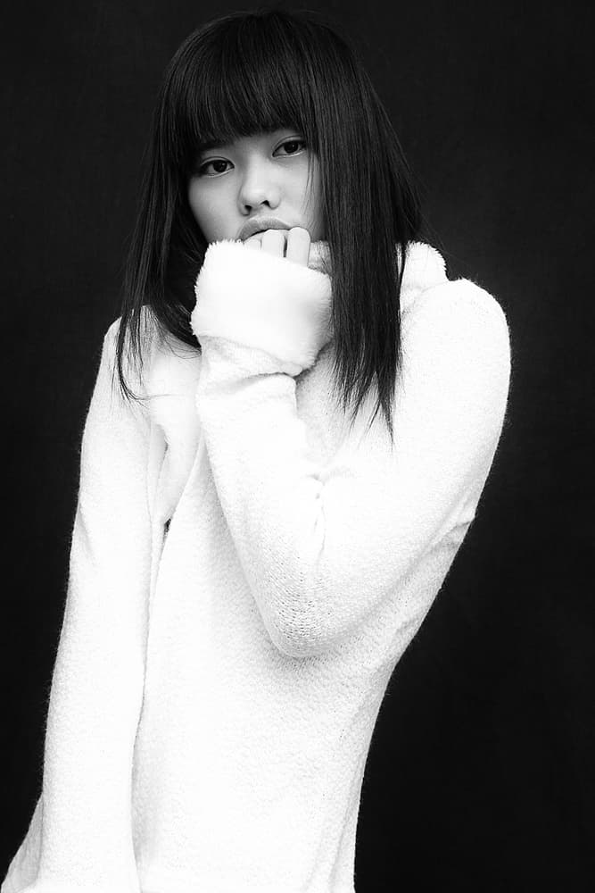 Thoughtful Asian Woman Portrait by David McCracken — canvas wall art