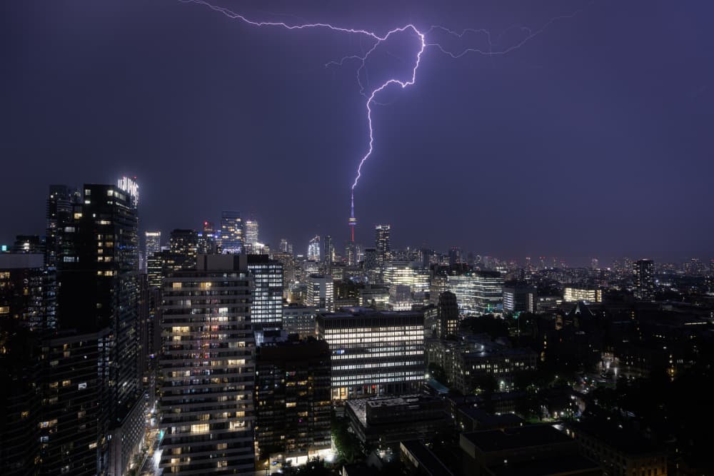 Dramatic City Lightning by Junbo Liang — canvas wall art