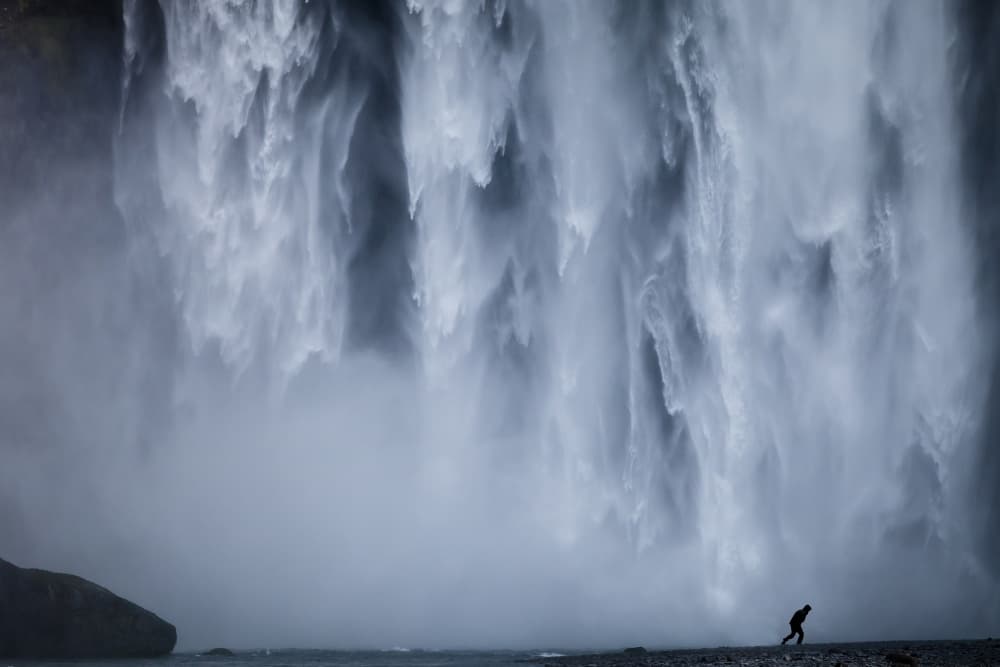 Powerful Cascade Lone Figure by Wim Denijs — canvas wall art