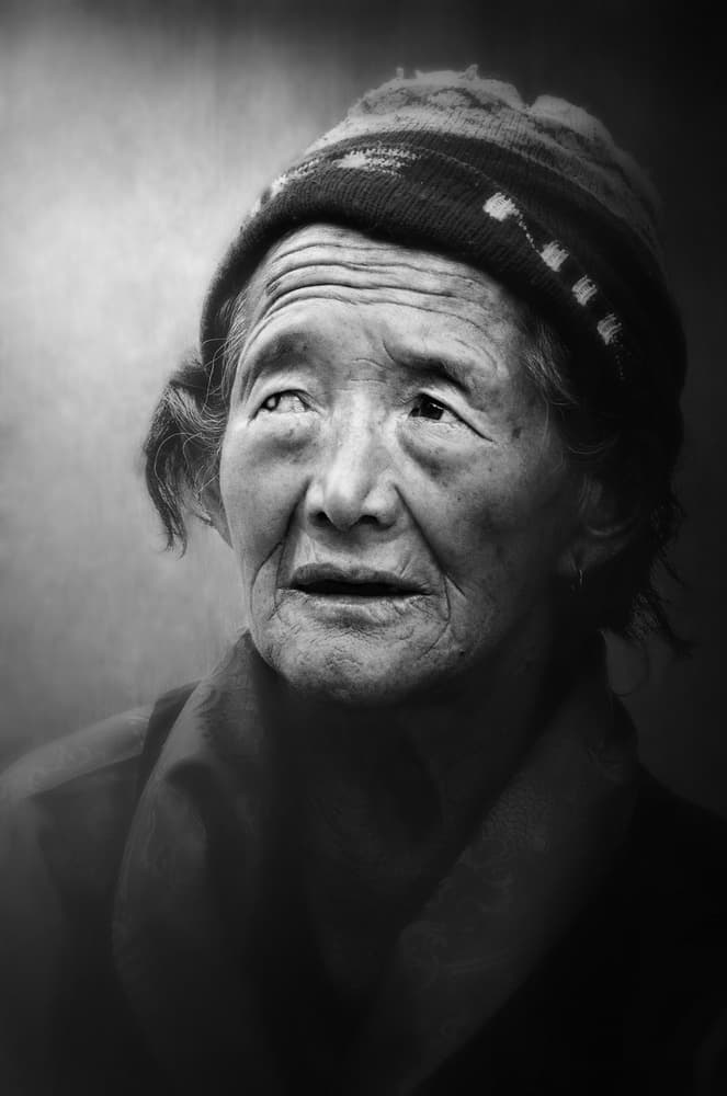Pensive Elderly Woman by Sayan Chakravarty — canvas wall art