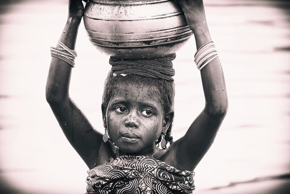 African Girl Carrying Water by Elena Molina — canvas wall art