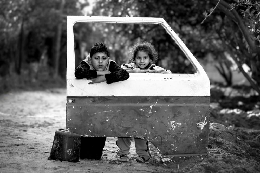Children In Car Door by Hazem Swidan — canvas wall art
