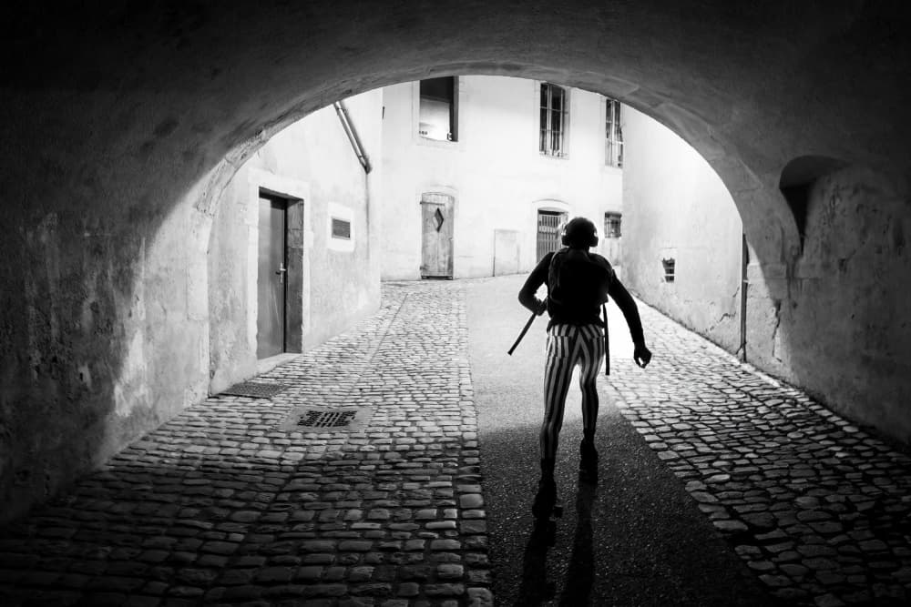 Lone Figure Cobblestone Alley by Adam Dauria ☂ — canvas wall art