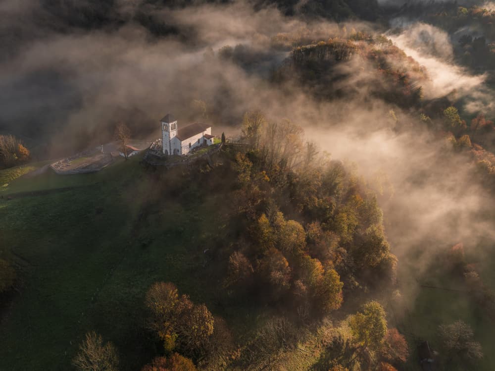 Golden Foggy Hilltop Church by Jure Kravanja — canvas wall art