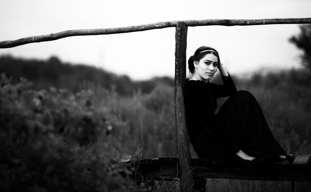 Pensive Woman Outdoors by Julien Oncete — canvas wall art