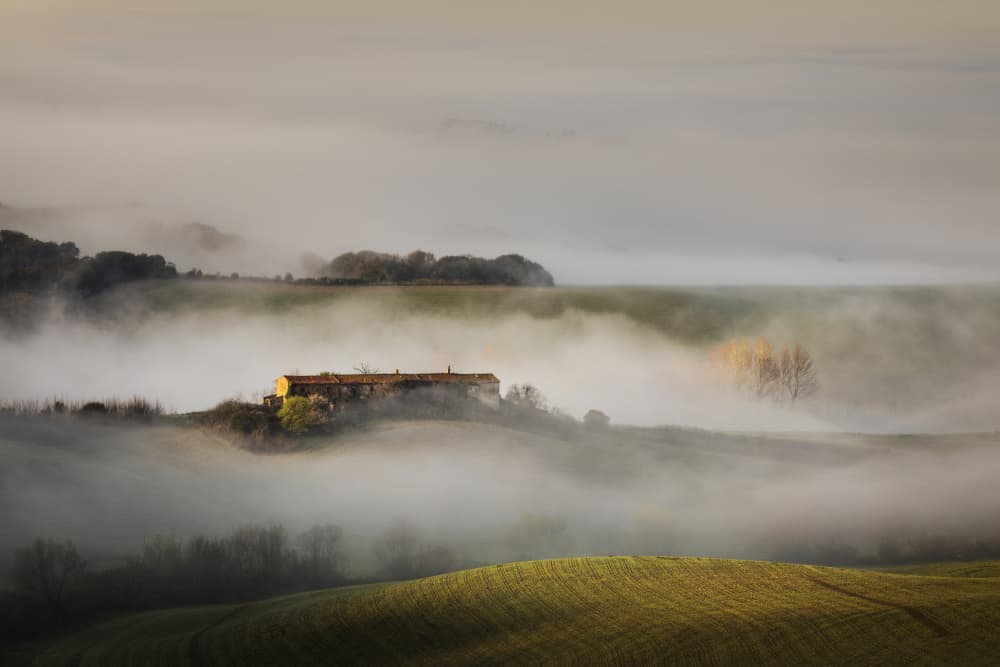 Misty Farmhouse Landscape by Andrea Lorenzetti — canvas wall art