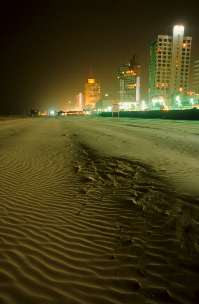 Night Beach City Lights by Tal Paz-Fridman — canvas wall art