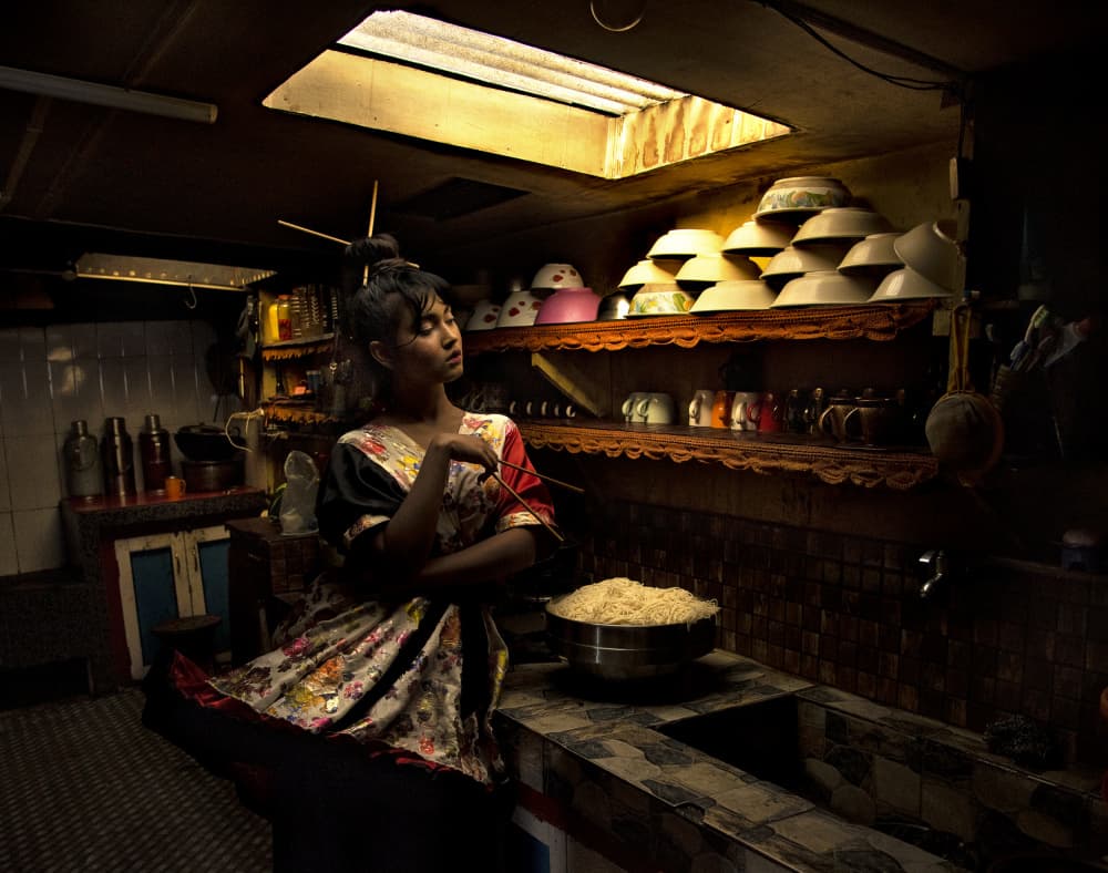 Woman in Kitchen Light by Rajat Dawn — canvas wall art