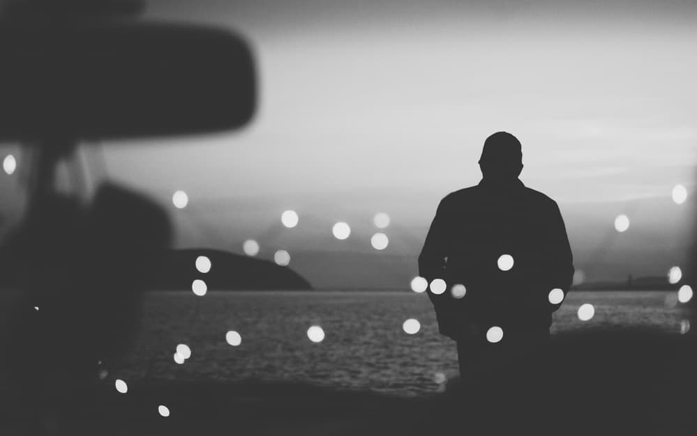 Man Silhouette Bokeh Lights by Aleksandr Sumarokov — canvas wall art