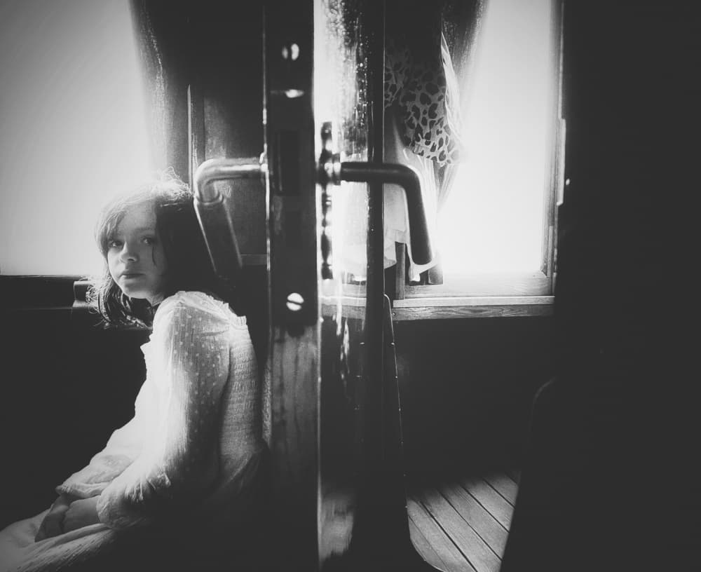 Pensive Girl by Window by Delphine Margau — canvas wall art