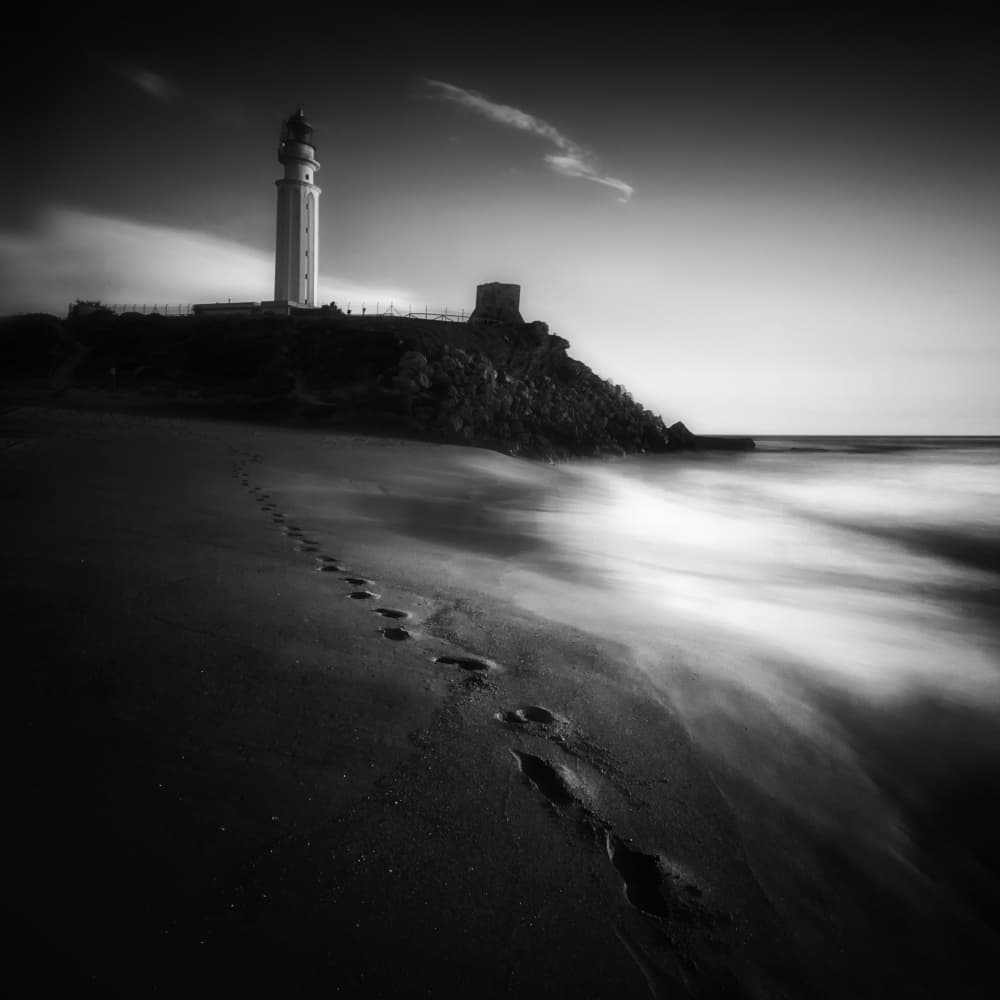 Solitary Lighthouse Beach by Juan Marín Gómez — canvas wall art
