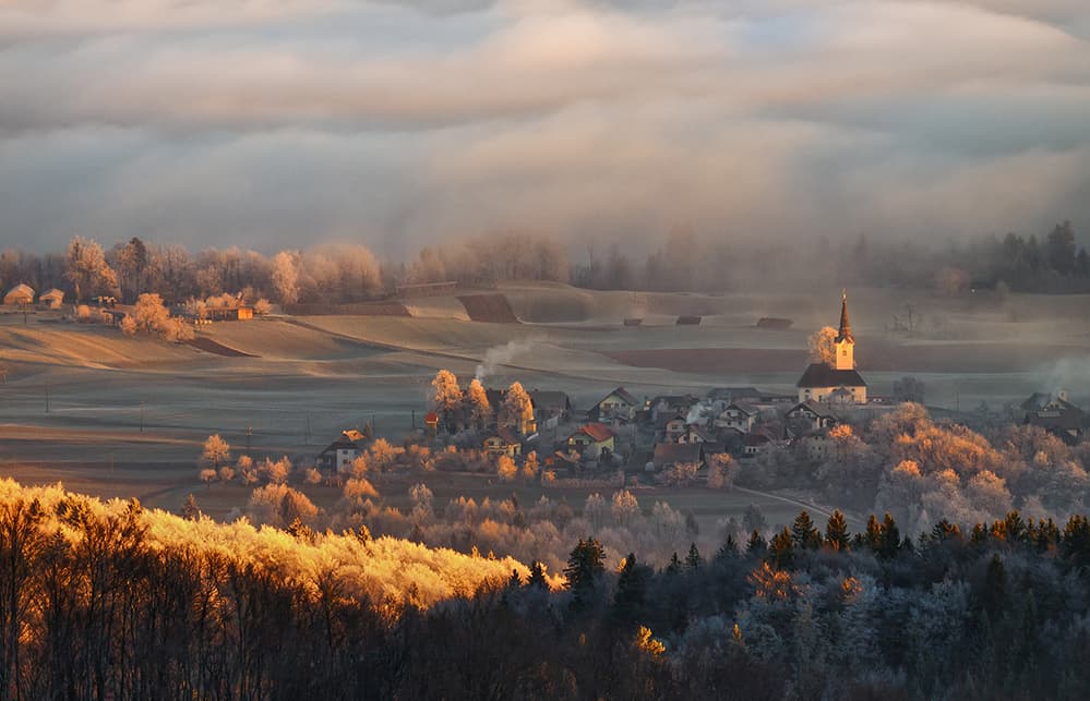 Golden Winter Village by Ales Komovec — canvas wall art