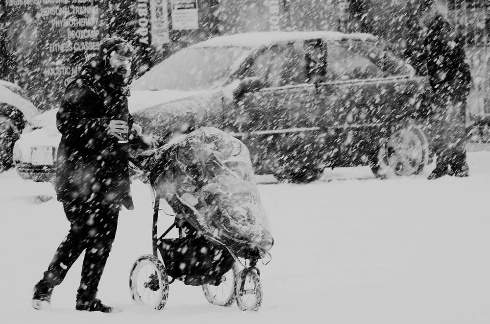 Snowy Stroller Walk by Jian Wang — canvas wall art