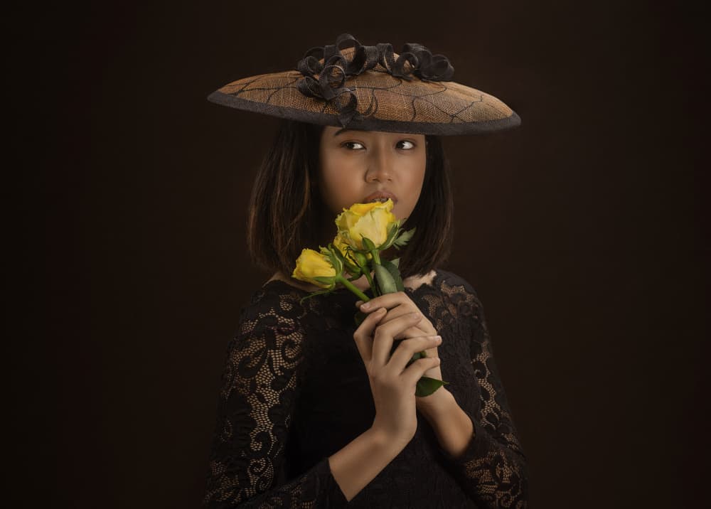 Thoughtful Girl Yellow Roses by Michael Allmaier — canvas wall art