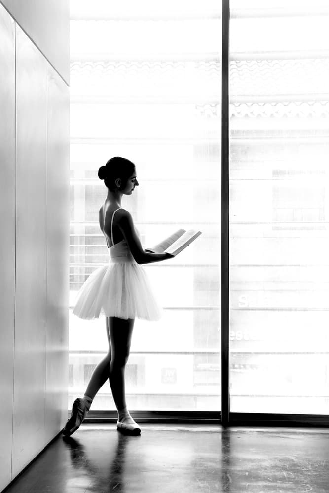 Ballerina Reading By Window by Paulo Medeiros — canvas wall art