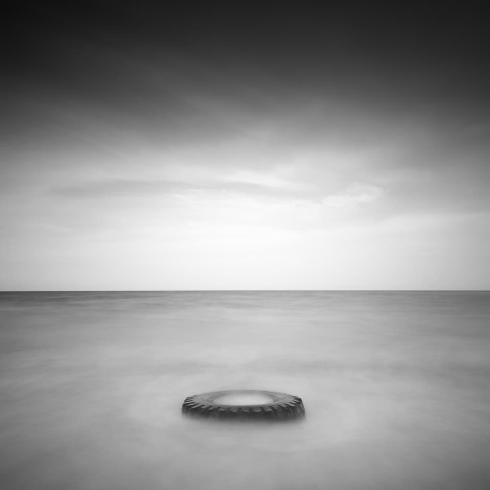Serene Floating Tire by Catalin Baican — canvas wall art