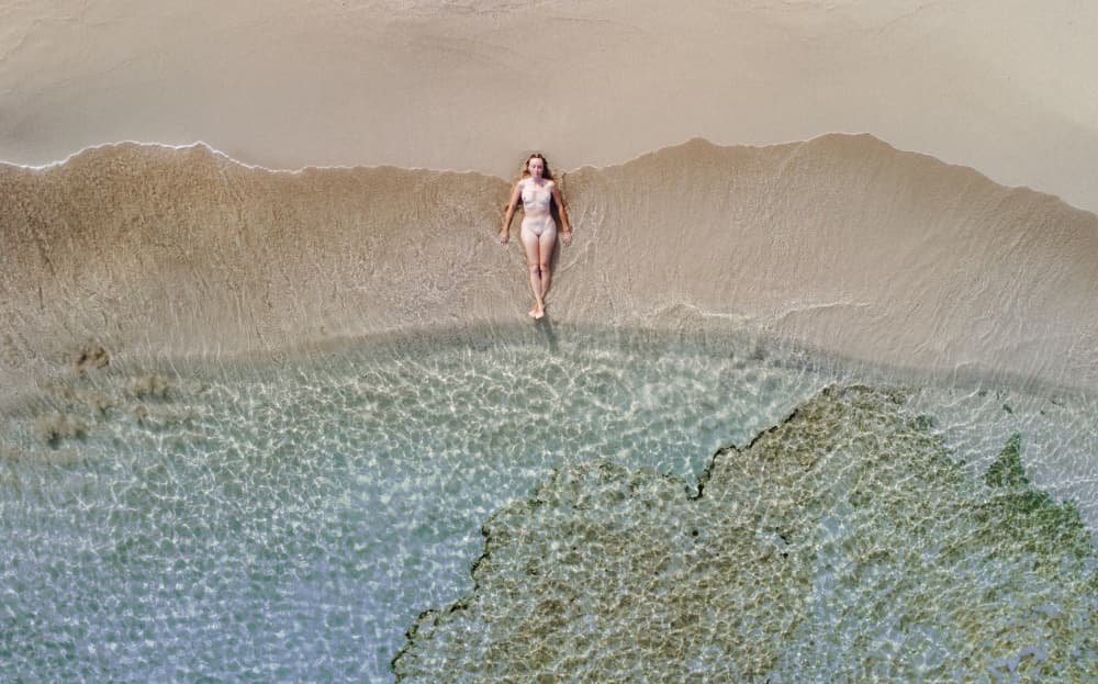 Woman on Tranquil Beach by carmenvillar — canvas wall art