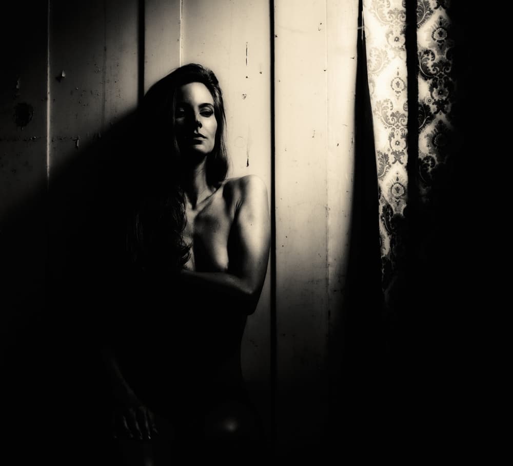 Pensive Woman in Shadow by Erkan Camlilar — canvas wall art