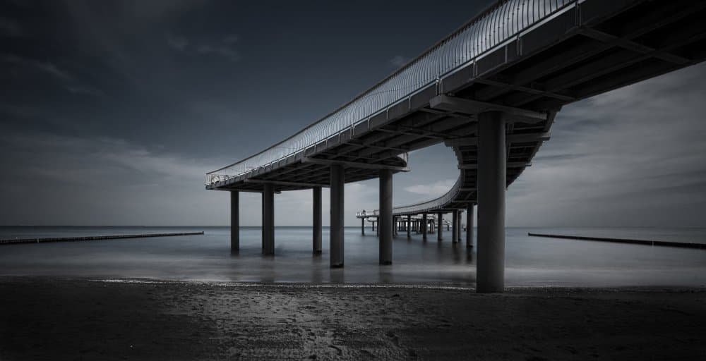 Moody Ocean Pier by mario.messer — canvas wall art