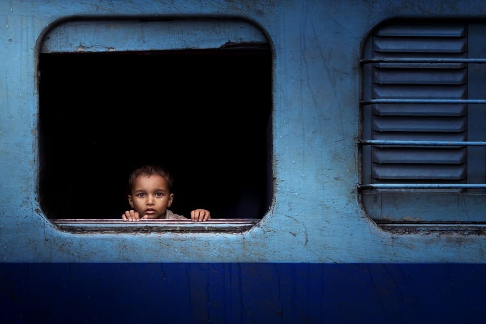 Curious Boy Train Window by Nasser Al-Nasser — canvas wall art