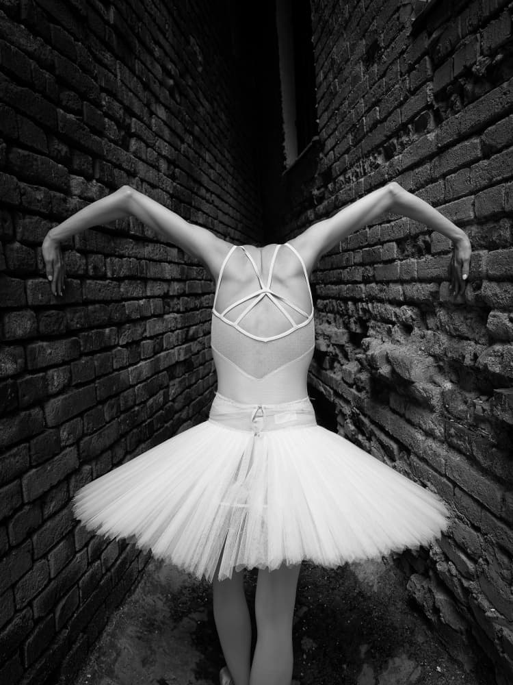 Ballerina in Urban Alley by Oles Paritskiy — canvas wall art