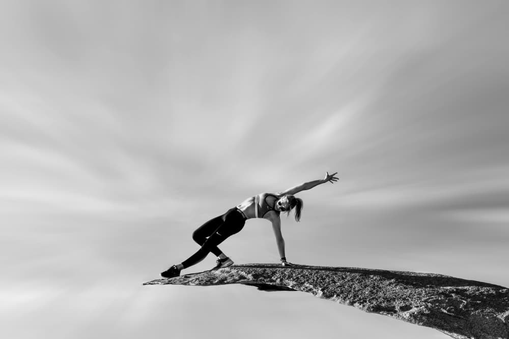 Graceful Cliff Pose by Ivy Deng — canvas wall art