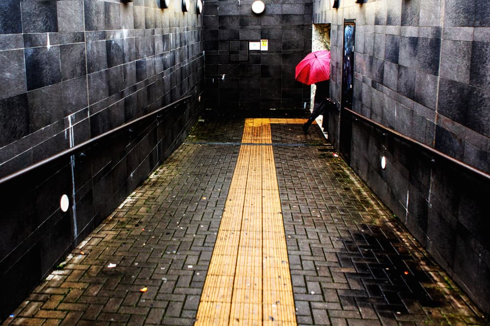 Red Umbrella Underpass by Massimo Della Latta — canvas wall art