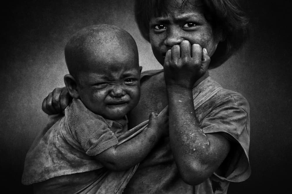 Distressed Young Siblings by Fadhel Almutaghawi — canvas wall art