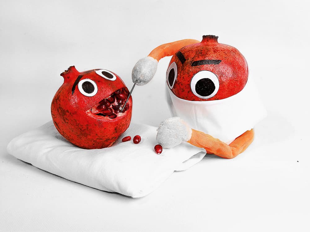 Funny Pomegranate Dental Visit by Ali Bader — canvas wall art