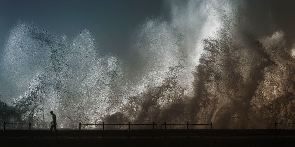 Man Against Crashing Waves by Ahmed Abdulazim — canvas wall art