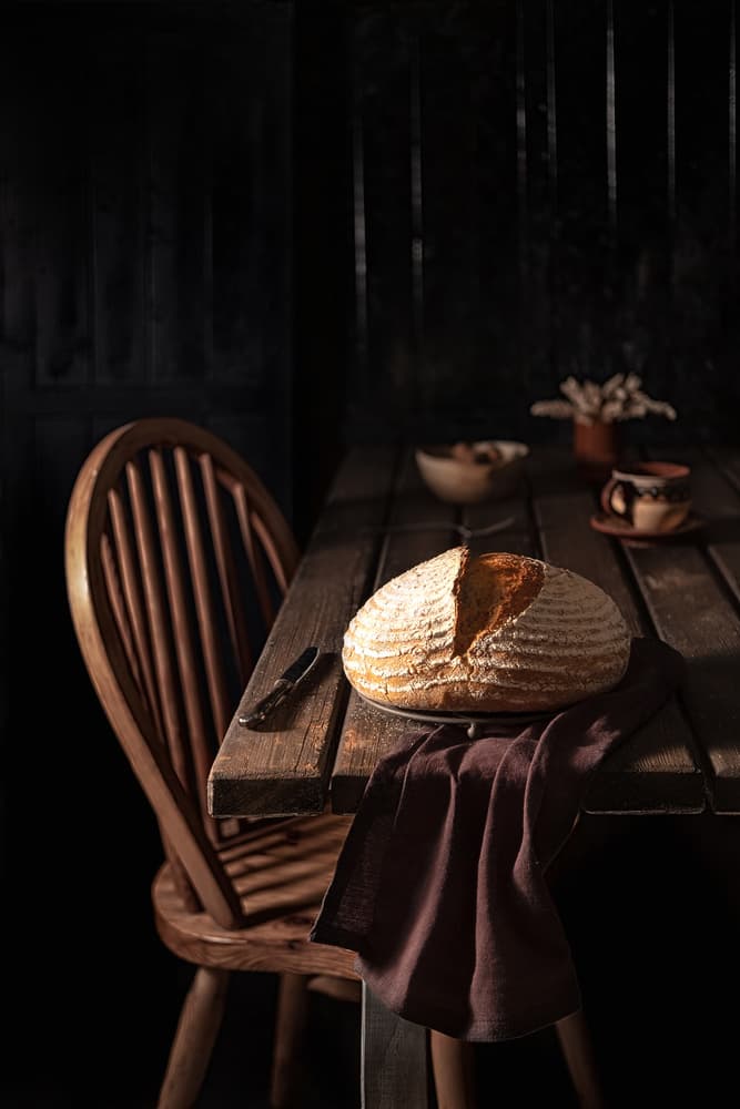 Rustic Bread on Table by Denisa VLAICU — canvas wall art