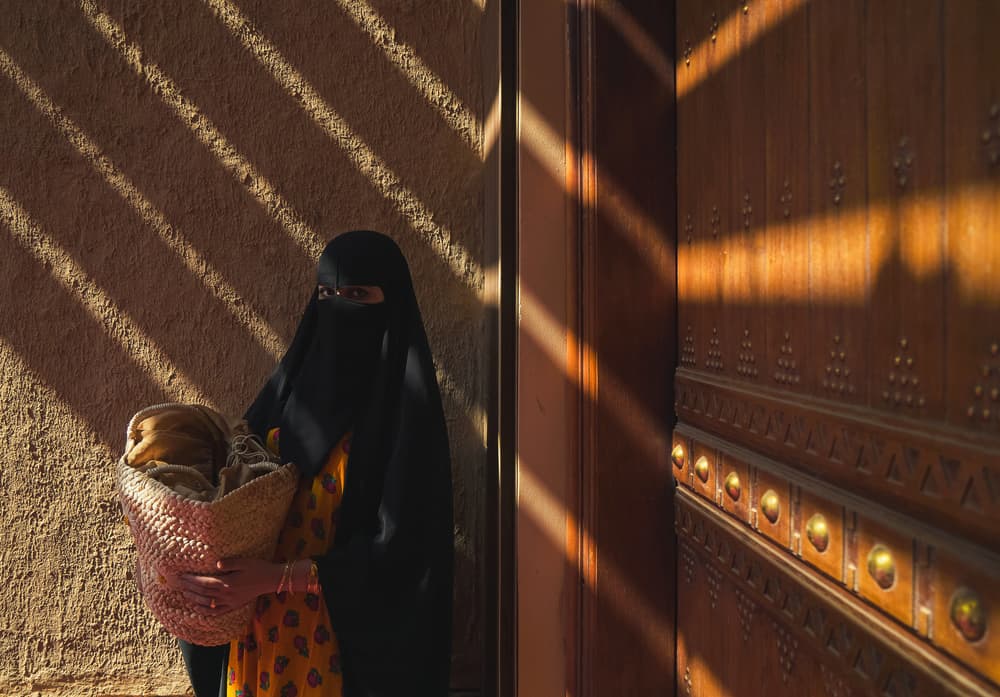 Veiled Woman Golden Light by Nasser Al-Nasser — canvas wall art