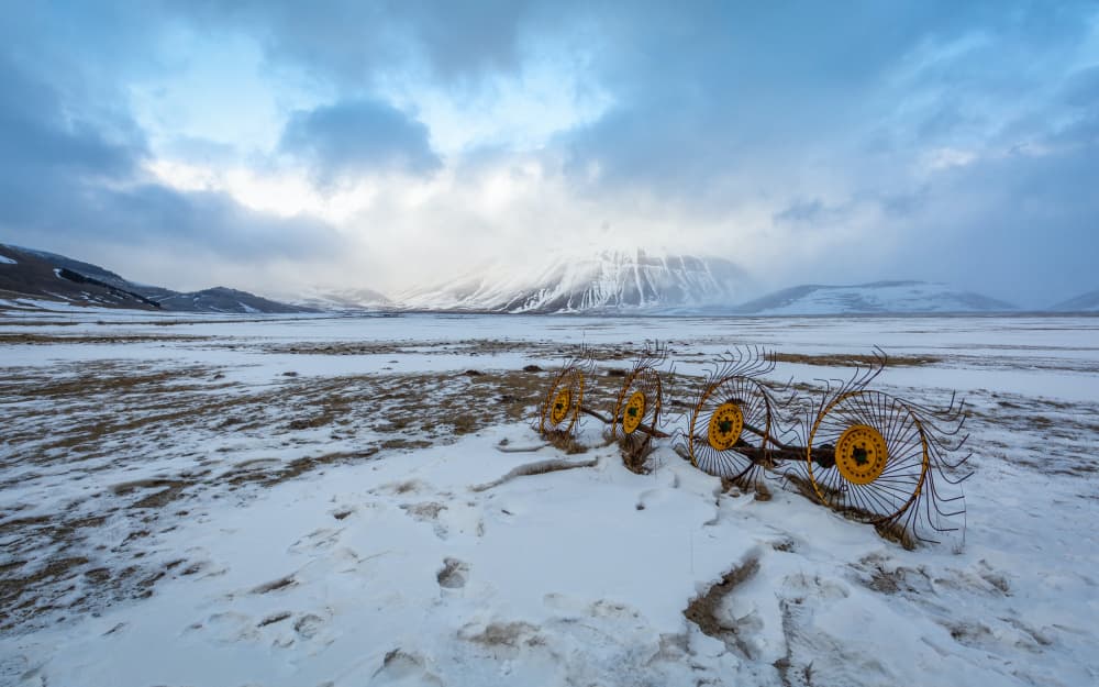 Snowy Mountain Farm Equipment by Sergio Barboni — canvas wall art