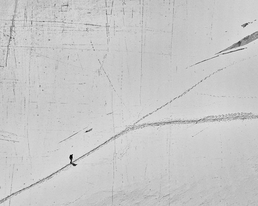 Solitary Snow Trek by Elena Raceala — canvas wall art