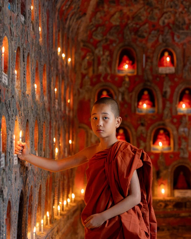 Young Monk Candle Light by ADIREK M — canvas wall art