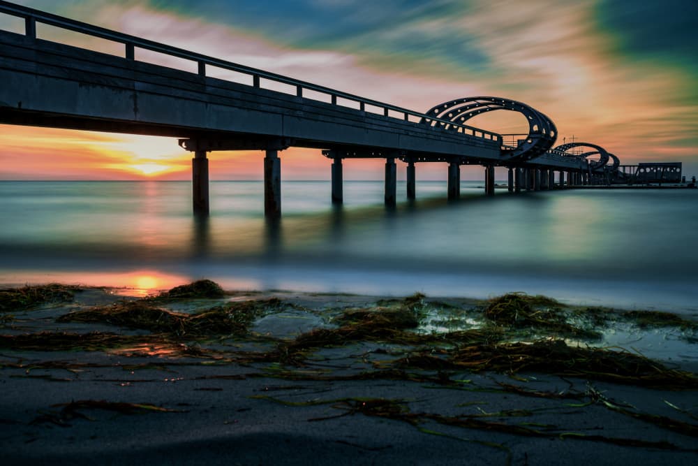 Vibrant Pier Sunset Reflections by Jürgen Muß — canvas wall art
